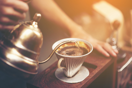 Drip brewing, filtered coffee, or pour-over is a method which involves pouring water over roasted, ground coffee beans contained in a filter.の写真素材
