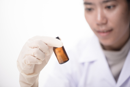 Closeup Portrait of Food Researcher Examination Activity of Bio Plant Seedlings in Nursery Laboratory, Botanist Lab Scientists Doing Biological Test on Organic Plants, Science Research Projectの写真素材