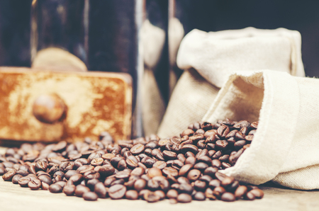 coffee beans on wooden background, arabica coffee, vintage filter imageの写真素材