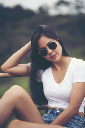 sexy asian girl on nature fieldの写真素材