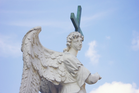 Roman statue with a crossの写真素材