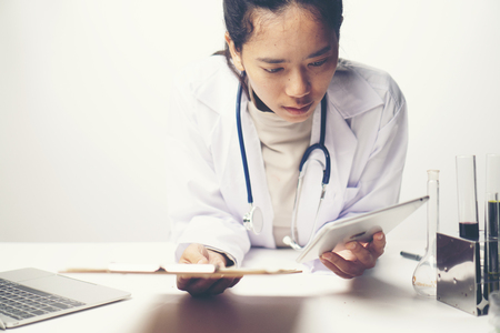 Doctors are analyzing health examination results.の写真素材