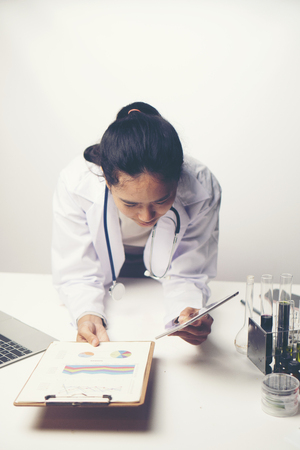 Doctors are analyzing health examination results.の写真素材