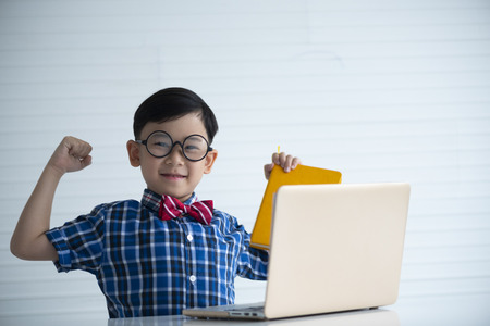 Boy smiling With laptop for learning