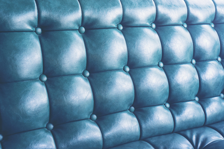 blue leather texture background with buttoned patternの写真素材