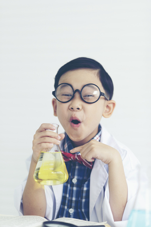 boy is making science experiments in a laboratoryの写真素材