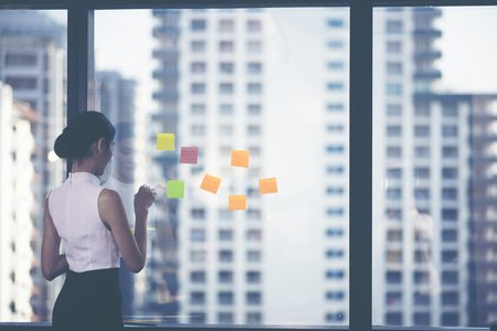 Successful team leader and business owner leading informal in-house business meeting.の写真素材