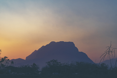 natural scene sunset with mountain and tree, tropical forestの写真素材