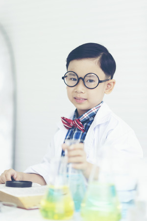 boy is making science experiments in a laboratoryの写真素材