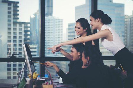 business woman team meeting at her workplace in modern officeの写真素材