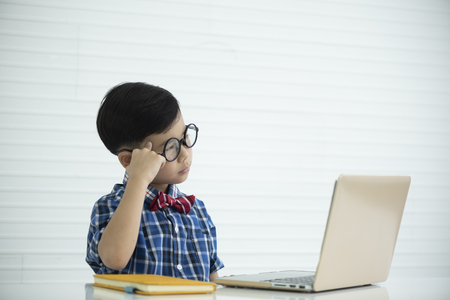 Portrait of a boy in classroom, education conceptの写真素材