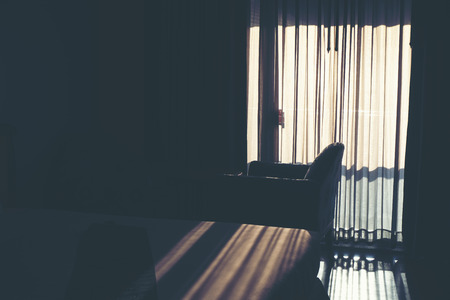 The white curtain separates the sunlight that shines into the bedroom.の写真素材