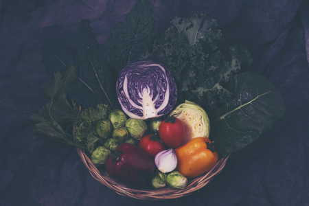 Various colorful vegetables in a basketの写真素材