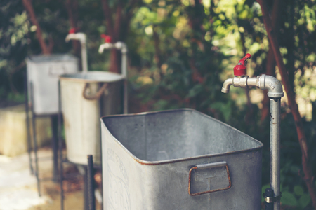 Iron water pipe in the parkの写真素材