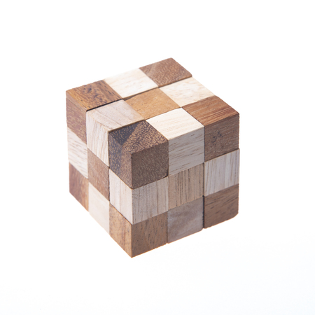 Wooden Brain Teaser toy, isolated on white Backgroundの写真素材