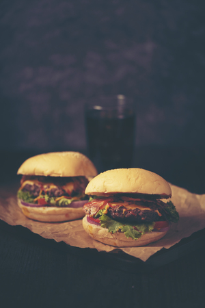 Close-up of home made tasty burgers on wooden tableの写真素材