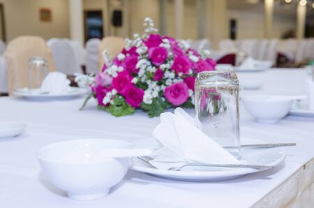 Dinner table in the banquet room of a luxury hotel, hall in hotelの写真素材
