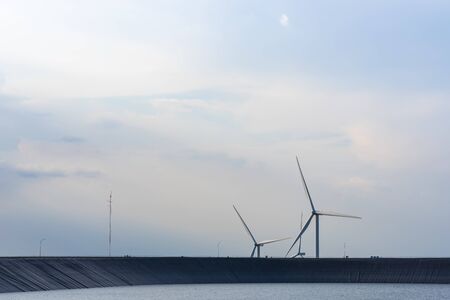 The wind turbine power working, blue sky, energy power conceptの写真素材