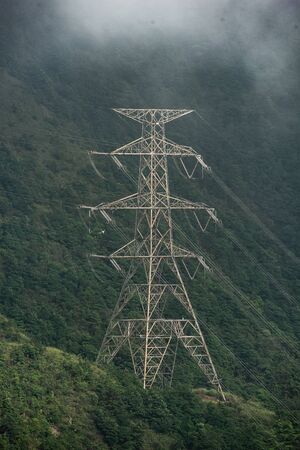 High voltage electric pole in the forest