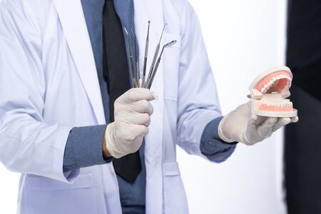 Dentist portraits and dental equipment, on white background