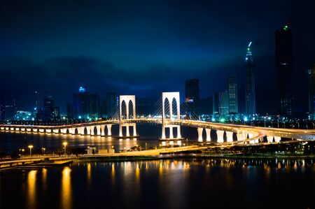 Macau cityscape at night, all hotel and tower are colorful lighten up with blue sky, Macau, China.