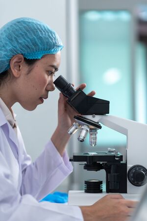 Doctors are diagnosed in the laboratory. With microscopyの写真素材