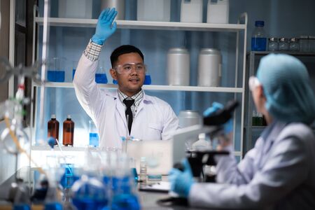 Scientific researchers team are working in the laboratory