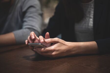 young Asian women live at home and using smartphone