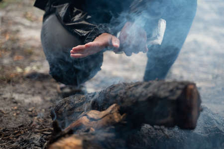 campfire winter night in the forest, fire baking and warm cozy conceptの写真素材