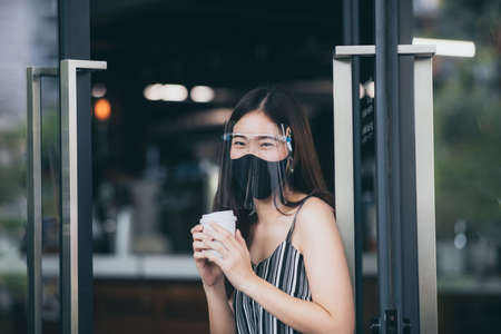 young Asian woman wearing surgical face mask for health protection, disease virus flu epidemicの写真素材