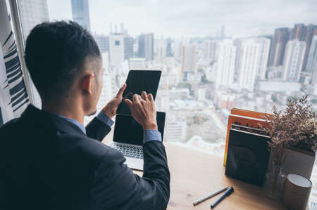 Smart and intelligence business man of the future for a financial and ecommerce projectの写真素材