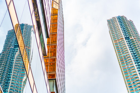 HONG KONG, CHINA - January, 2021 : Golden tall buildings and glass reflections in Hong Kong Island Business concepts of buildings and architectureのeditorial素材
