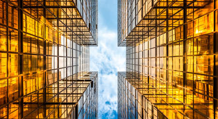 HONG KONG, CHINA - January, 2021 : Golden tall buildings and glass reflections in Hong Kong Island...