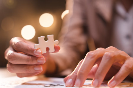 Business person team work holding jigsaw to connecting successful puzzle piece for matching to goals target, success and start up new project in business marketing plan conceptの写真素材
