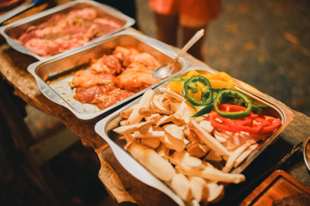 Summer BBQ Party, Grilling Fresh Meat and Tasty Steak Over Hot Charcoal Flames, Delicious Smoke and Heat Infusing Air, Creating a Dinner Experienceの写真素材