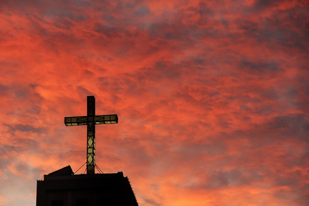 Catholic church with the red sky backgroundの写真素材
