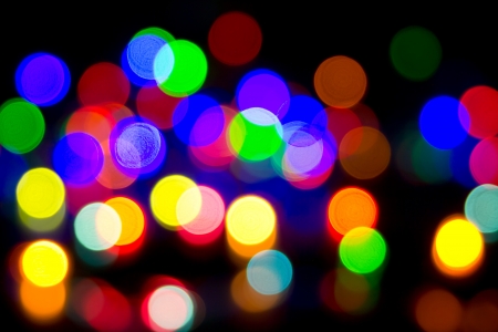 Defocused bokeh image of colorful christmas fairy lightsの写真素材