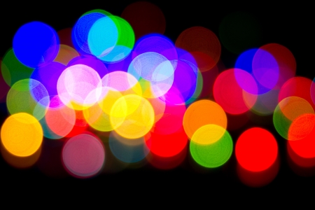 Defocused bokeh image of colorful christmas fairy lightsの写真素材