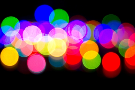 Defocused bokeh image of colorful christmas fairy lightsの写真素材