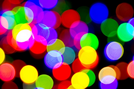 Defocused bokeh image of colorful christmas fairy lightsの写真素材