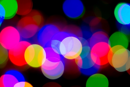 Defocused bokeh image of colorful christmas fairy lightsの写真素材