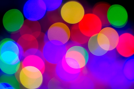 Defocused bokeh image of colorful christmas fairy lightsの写真素材