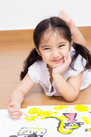 Little Asian artist child drawing and painting の写真素材