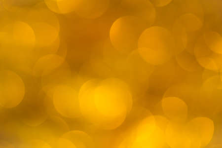 Abstract defocused gold bokeh backgroundの写真素材