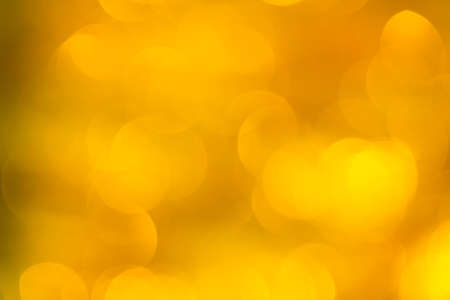 Abstract defocused gold bokeh backgroundの写真素材