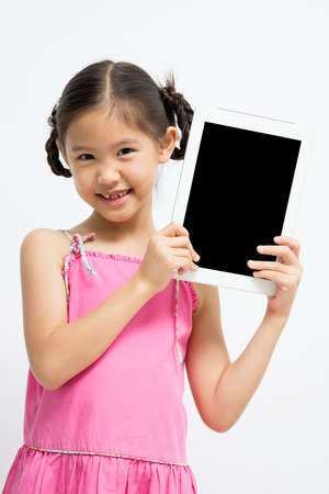 Happy Asian girl with tablet computerの写真素材