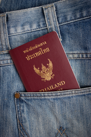 Thai passport in pocket of a jeansの写真素材