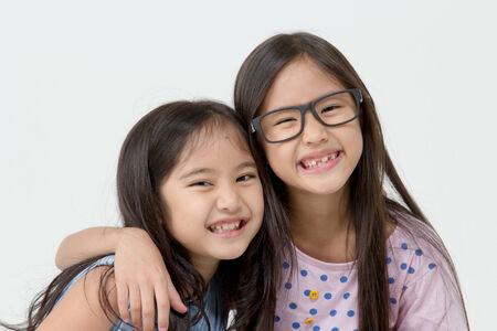 Portrait of little cute Asian girl on isolated backgroundの写真素材