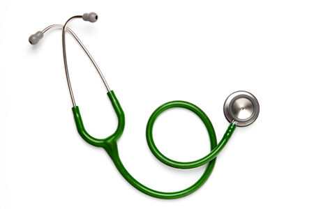Old green stethoscope on isolatedの写真素材