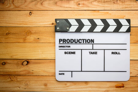 Movie slate film on wooden tableの写真素材